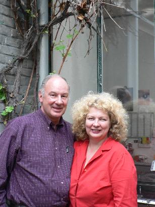Cornelis and Marlene under a vine outside studio Dumas in Amsterdam