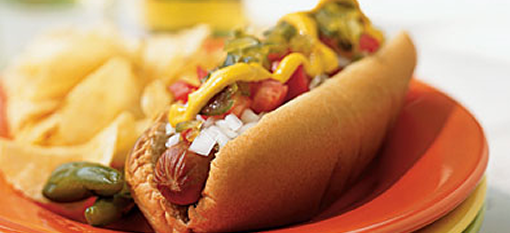 Hot Dogs topped with spicy relish and mustard sauce photo
