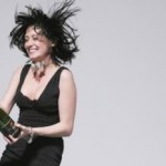 Woman arrested for splashing champagne photo