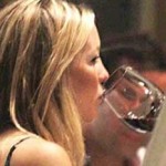Kate Hudson celebrates her baby bump with a glass of red photo