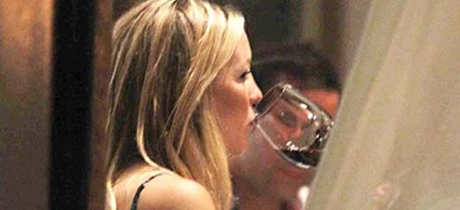 Kate Hudson celebrates her baby bump with a glass of red photo