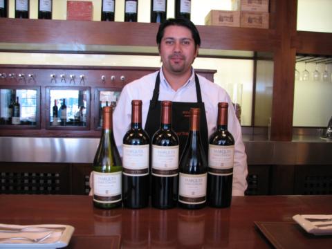 One of the sommeliers in the tasting room of Concha Y Toro priding himself in front of the Marques range.