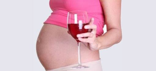 A glass of wine a day while pregnant will not harm your baby photo