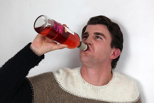 Man downs bottle of wine in 5 seconds photo