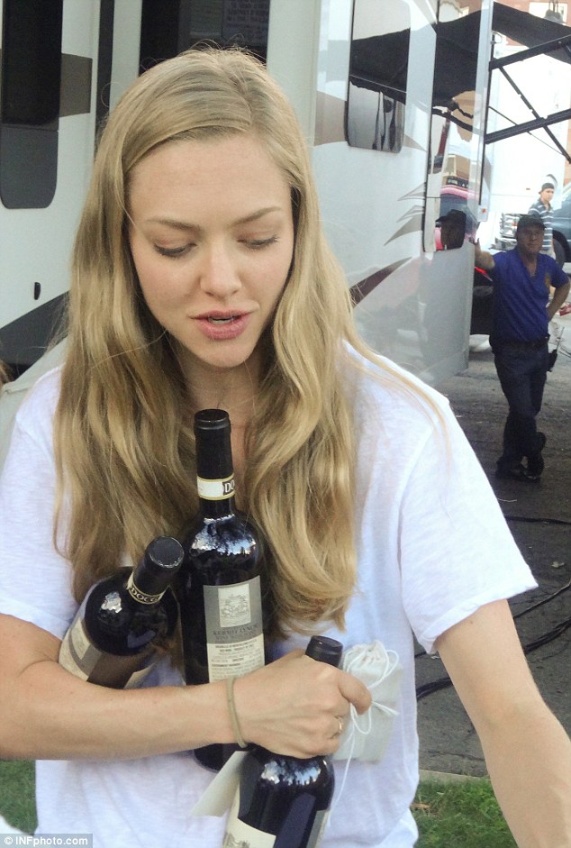 Amanda Seyfried juggles bottles of wine on the set of Ted 2 photo