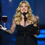 Cheers to that! Kelly Clarkson indulges in her first glass of wine in ten months photo