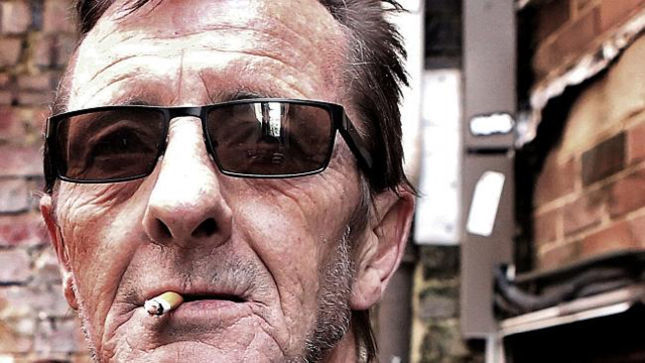 AC/DC drummer violates house arrest by drinking alcohol with prostitutes photo