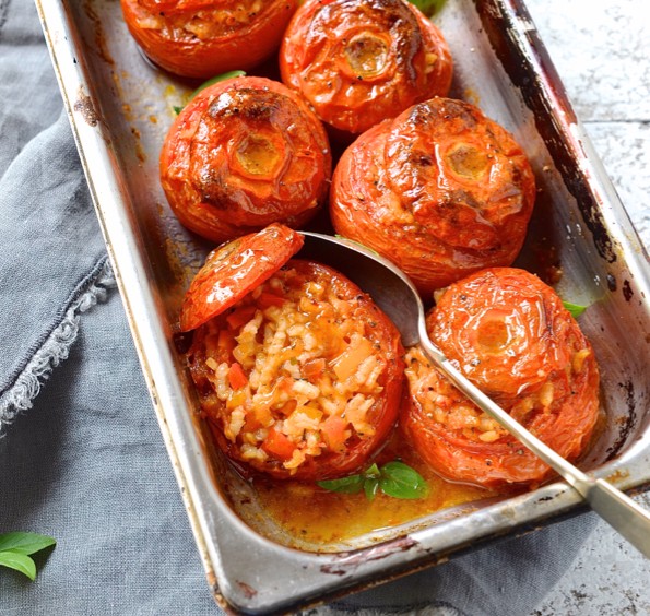 Saffron risotto stuffed tomatoes photo