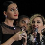 Katy Perry shares a drink with Madonna on stage photo