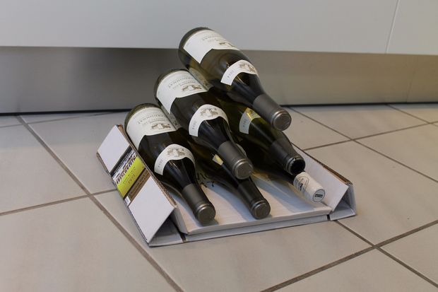 How to make a fancy wine bottle display with a cardboard box photo