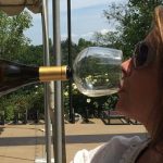 The Guzzle Buddy turns your wine bottle into a wine glass photo