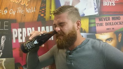 Maljan Attempts To Down A Beer Through His Nose photo