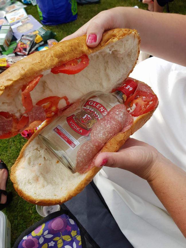 Woman caught with bottle of vodka inside a giant sandwich at event photo