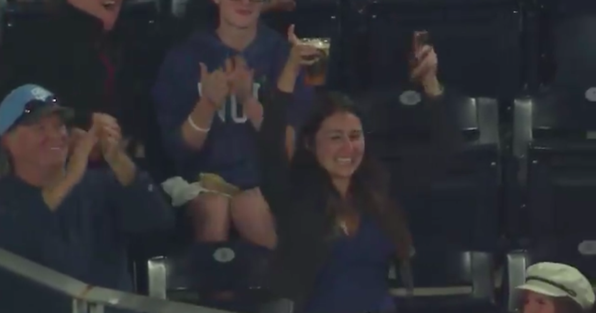 Fan Knows Just What To Do After A Baseball Lands In Her Beer photo
