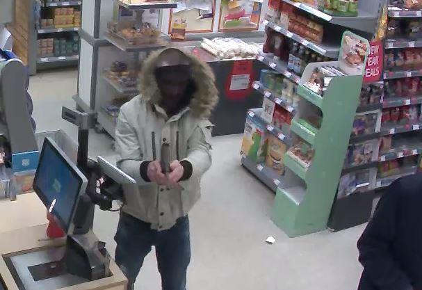 Armed Robbers Foiled By Beer Bottle photo