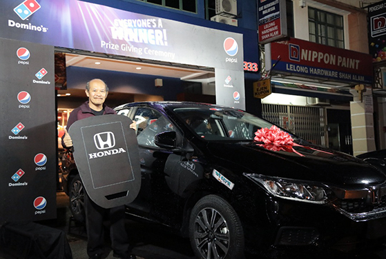 Winner Drives Home Honda City In Contest By Domino’s Pizza photo