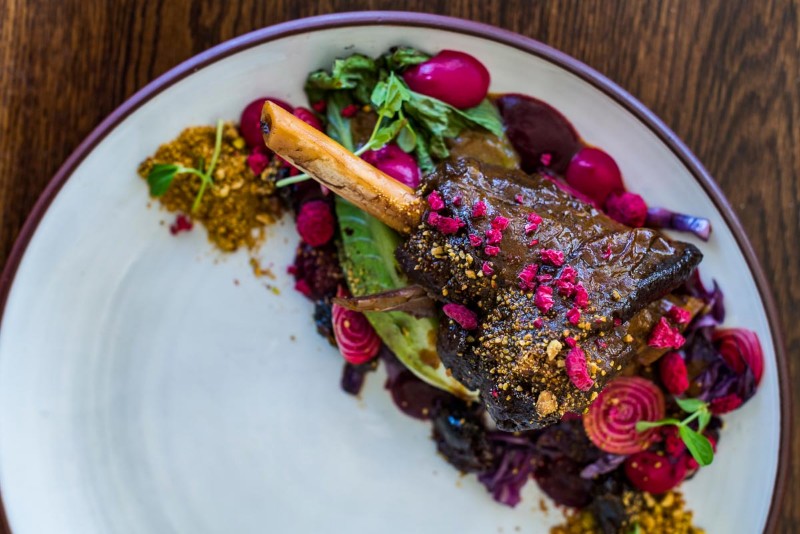 Venison shanks with baby beets, chestnuts and blueberries photo