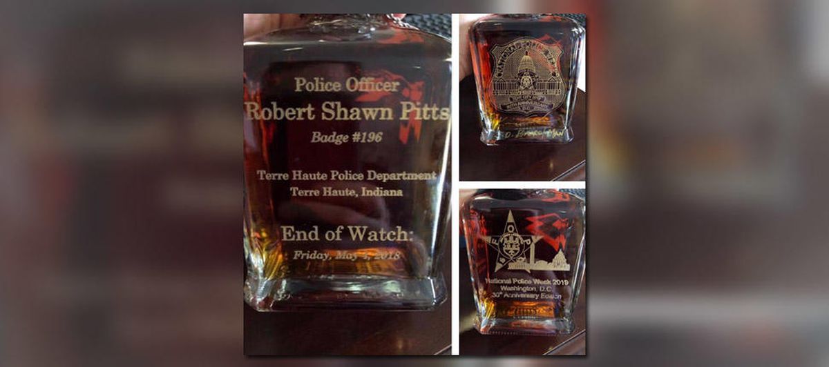 Jack Daniels Presents Custom Whiskey Bottle To Fallen Indiana Officer’s Family photo