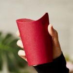 Folding disposable coffee cup has no need for plastic lids photo