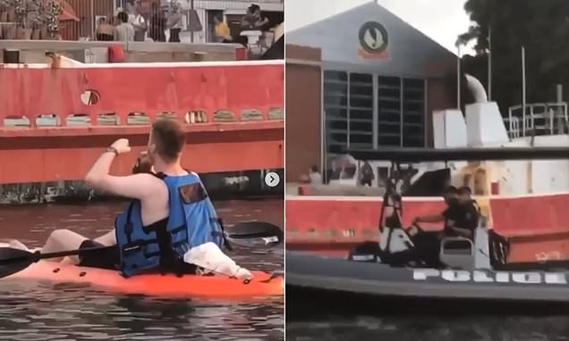Kayaker Drinks Whiskey Before Water Police Arrive Outside Festival photo
