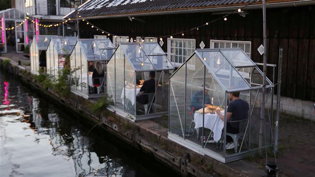 Watch: Dutch Restaurant Tests Glass Booths For Dining Amid Coronavirus photo