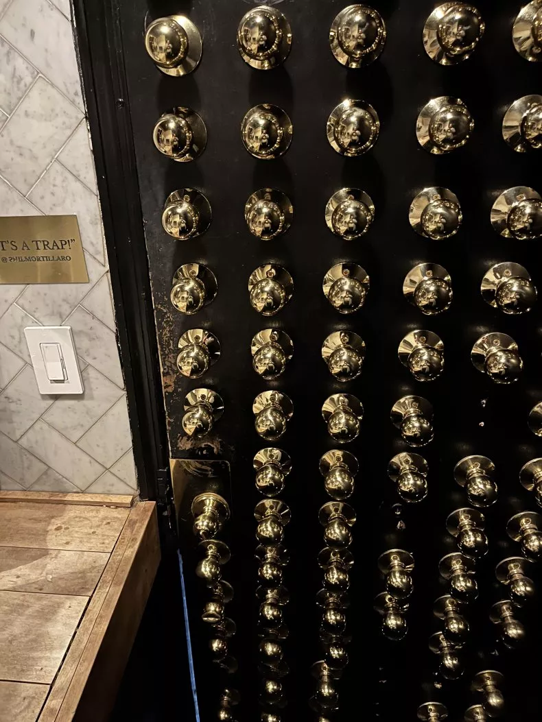 New York Bar With Nearly 100 Knobs On Toilet Door Branded “Impossible” To Figure Out After A Drink Or Two photo